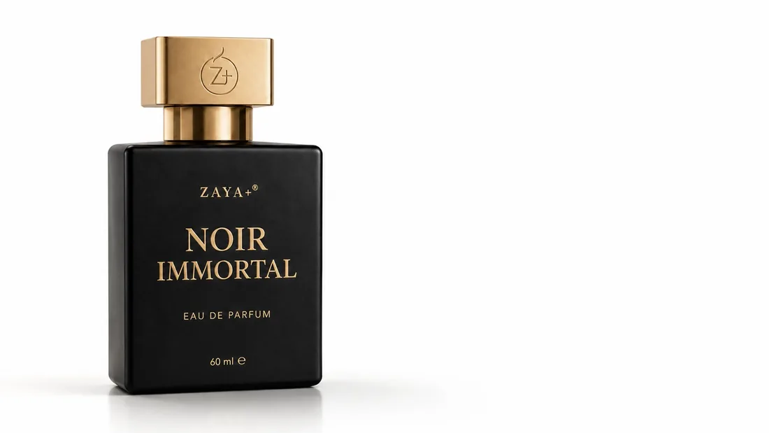The Noir Immortal flacon by ZAYA+ — matte black glass with a brushed gold cap, on a clean white background