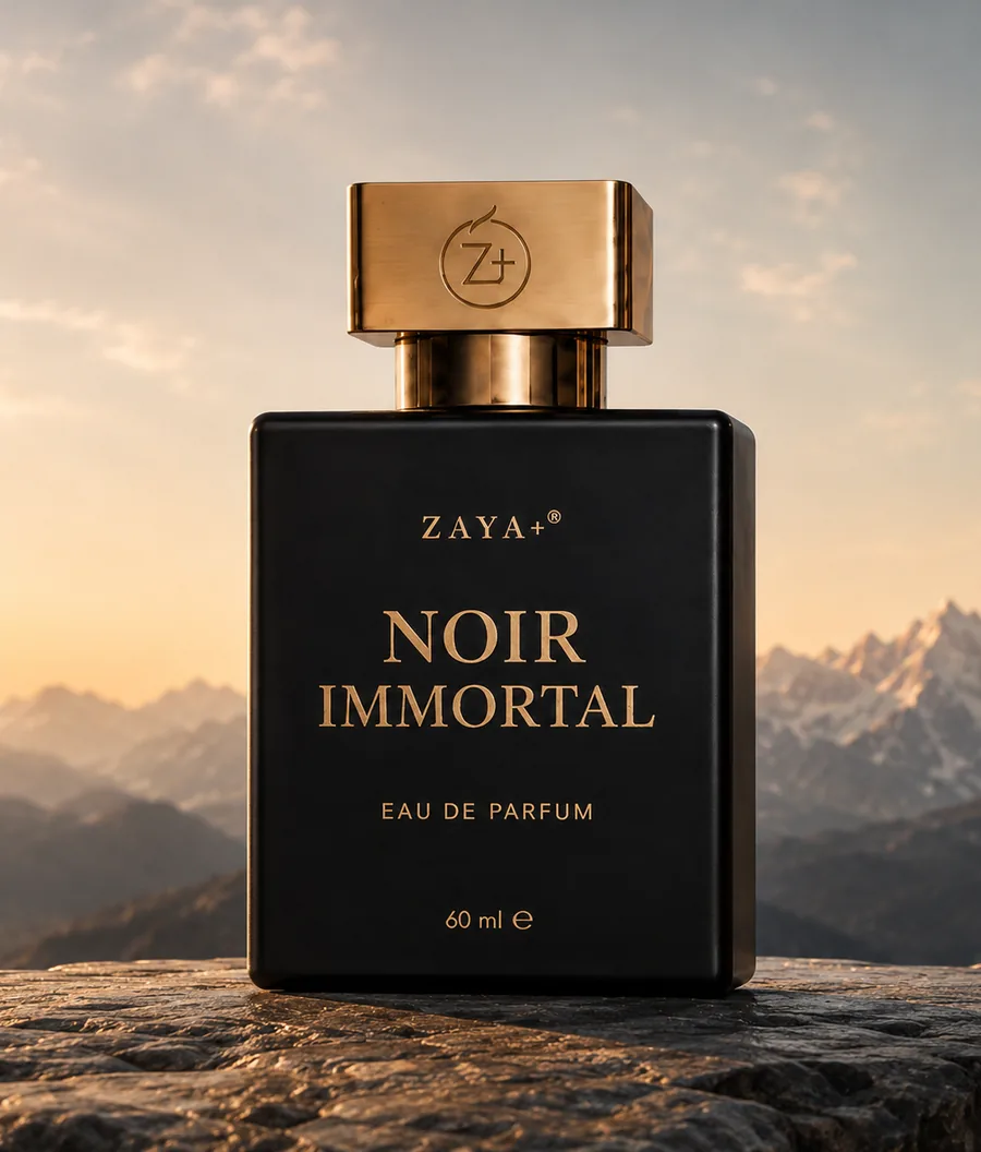 ZAYA+ Noir Immortal bottle on alpine stone above a sea of cloud at dawn